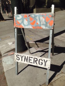 Road sign saying Synergy