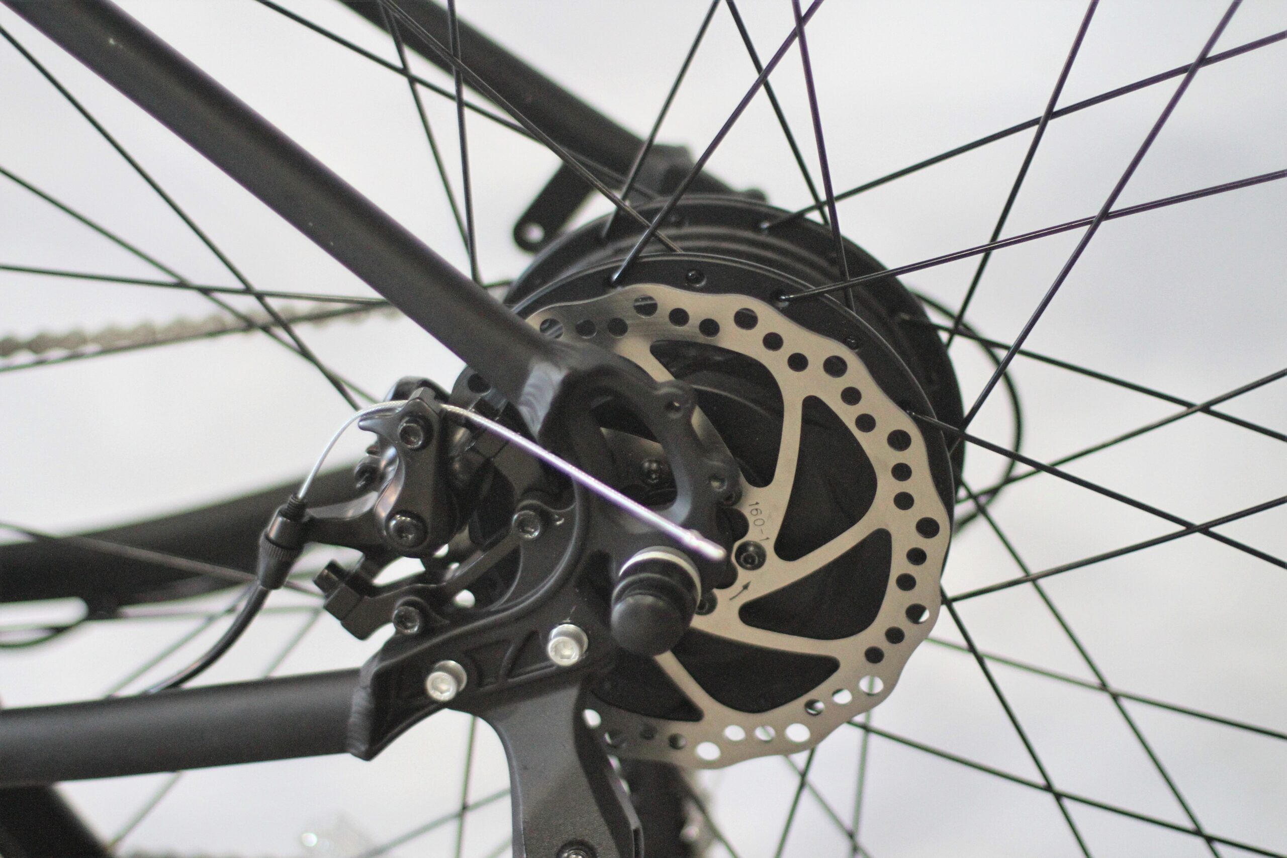 Close up of hub of bicycle wheel with spokes